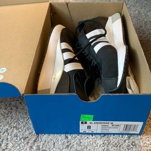 Adidas Black and White tennis shoes
